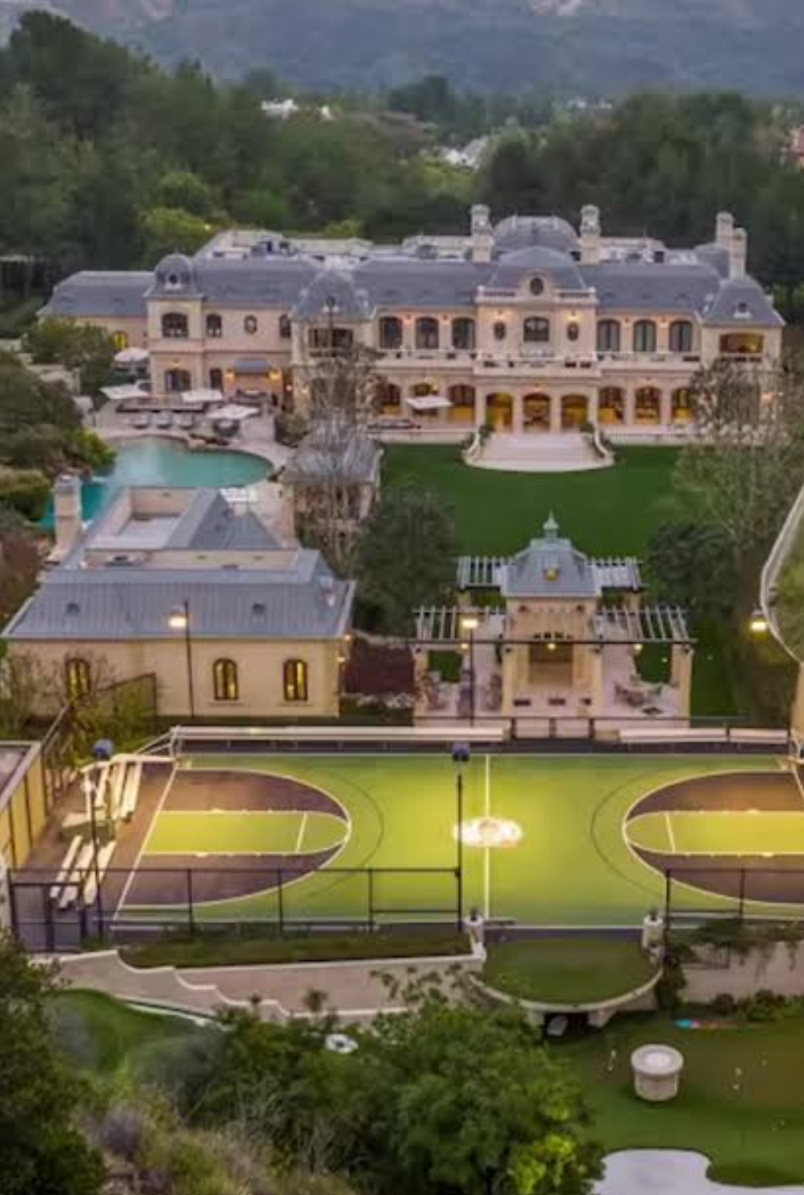 Multi-generational estate with mansion, gardens, pool and sports grounds — illustrating the scale and permanence of dynastic property wealth.